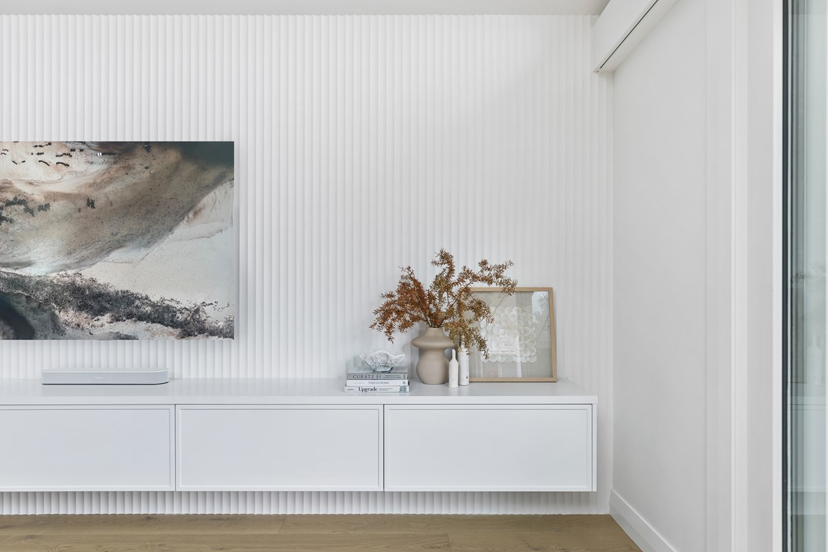 Thermoformed cabinetry in living room, framed thermoform cabinetry