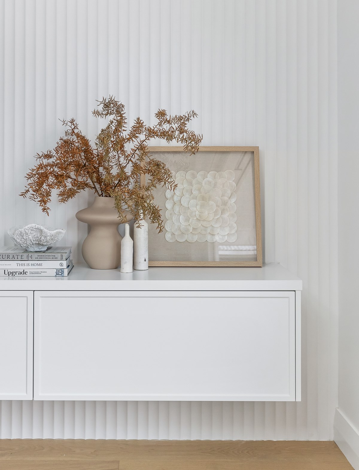 Thermoformed cabinetry in living room, framed thermoform cabinetry